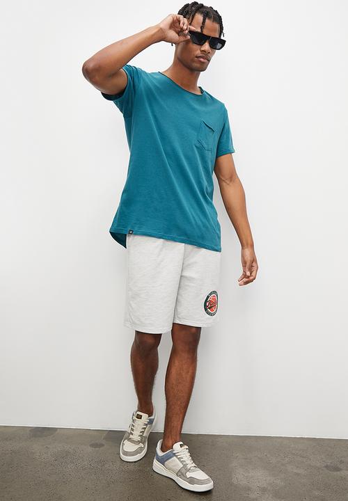 STYLE REPUBLIC - Slash raw edge curved hem pocket tee - teal