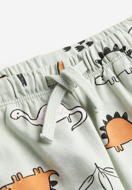 H&M - Cotton joggers - light sage green / dinosaurs 