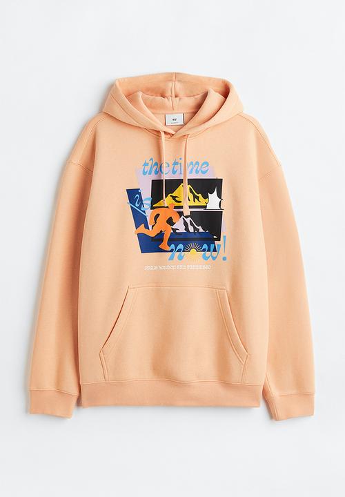 H&M - Relaxed fit printed hoodie - apricot/the time is now