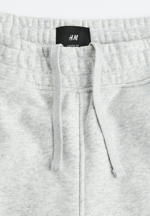 H&M - Loose fit printed sweatpants - light grey marl/varsity