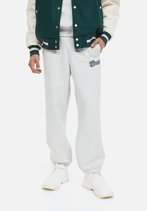 H&M - Loose fit printed sweatpants - light grey marl/varsity
