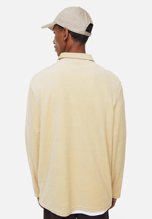 H&M - Regular fit velour polo shirt - light beige 
