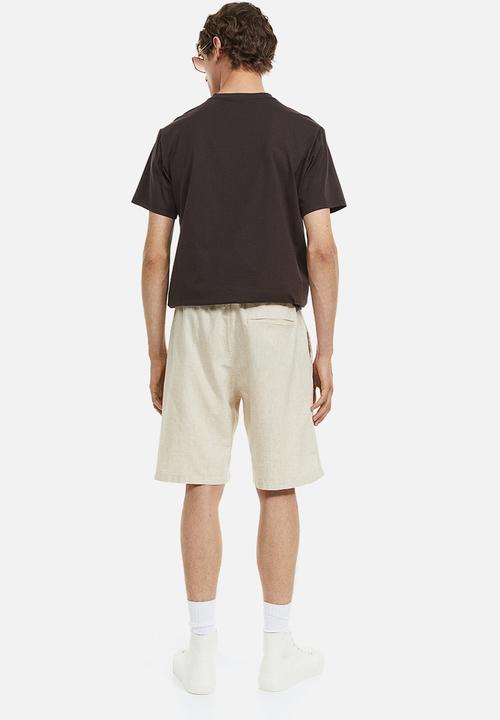 H&M - Regular fit shorts - light beige 