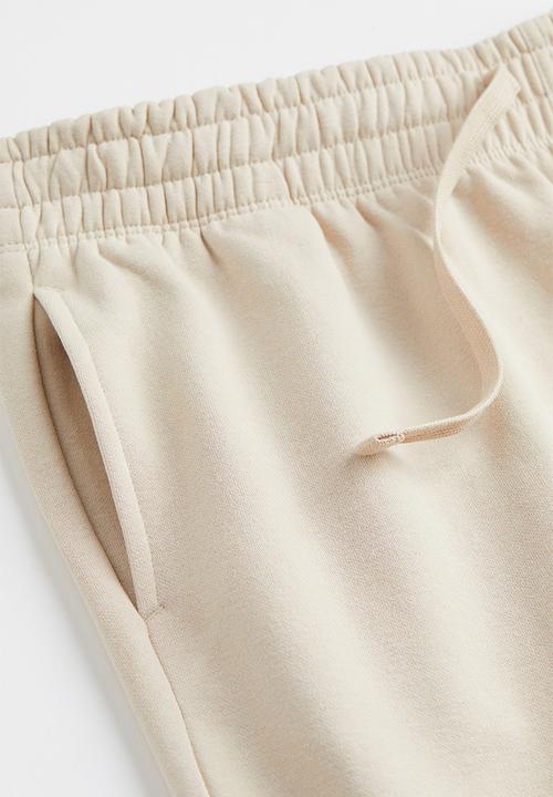 H&M - Regular fit sweatpants - cream 