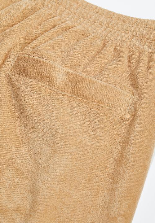 H&M - Relaxed fit terry track pants - beige