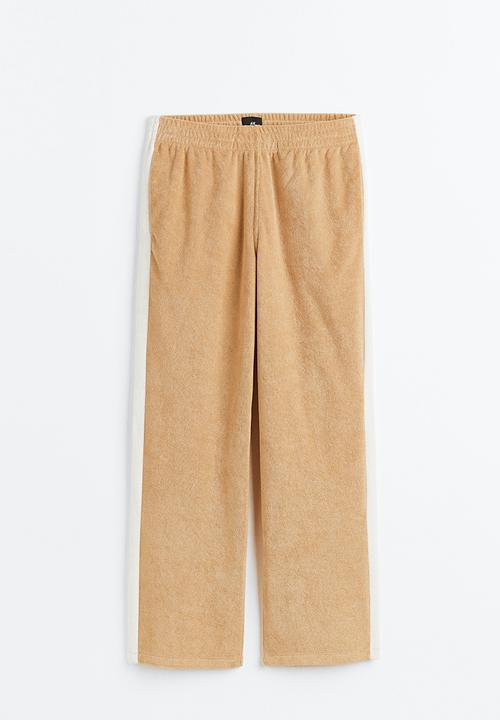 H&M - Relaxed fit terry track pants - beige