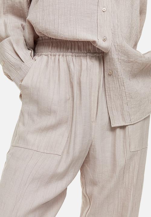 H&M - Tapered trousers - light beige 