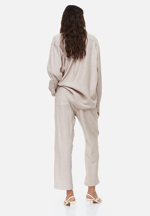 H&M - Tapered trousers - light beige 