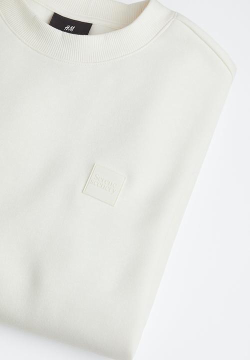 H&M - Relaxed fit appliquéd sweatshirt - white
