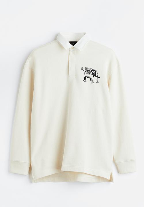 H&M - Relaxed fit printed polo shirt - cream/yale 