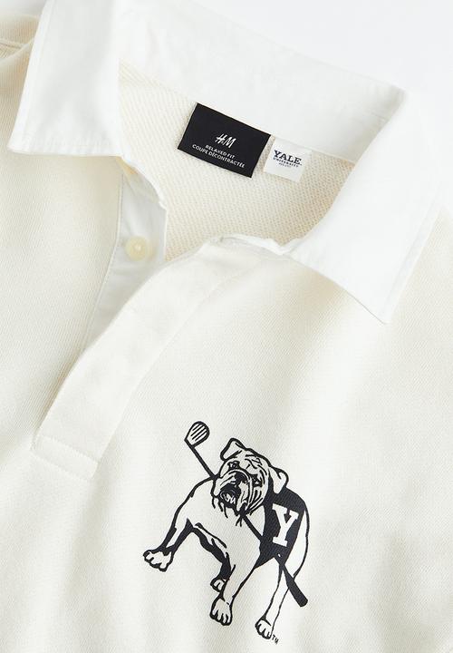 H&M - Relaxed fit printed polo shirt - cream/yale 