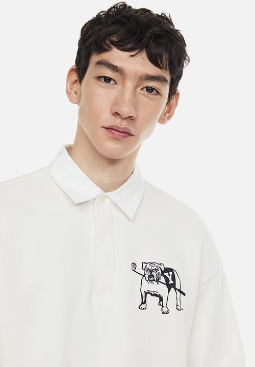 H&M - Relaxed fit printed polo shirt - cream/yale 