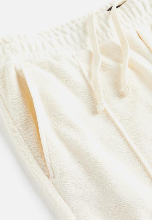 H&M - Regular fit terry joggers - cream