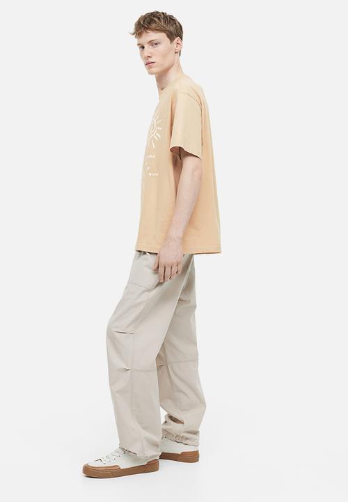 H&M - Relaxed fit printed t-shirt - beige/adventure on my mind 
