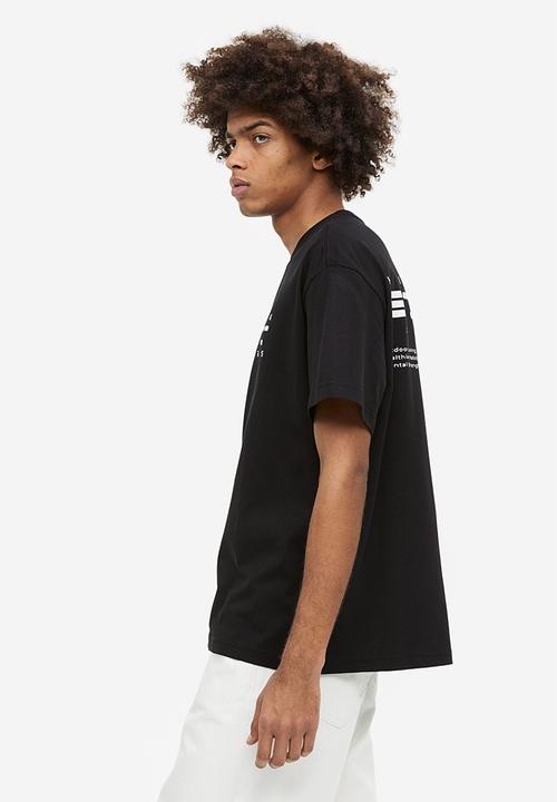 H&M - Relaxed fit printed t-shirt - black/story tellers