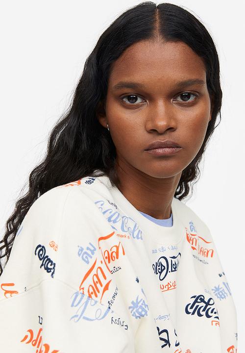 H&M - Printed sweatshirt - cream/coca-cola 