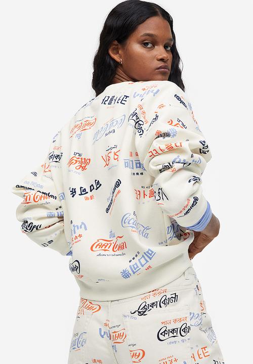 H&M - Printed sweatshirt - cream/coca-cola 