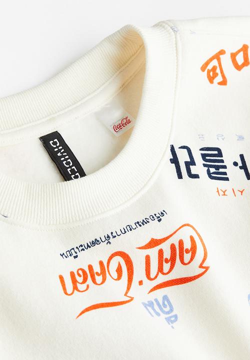 H&M - Printed sweatshirt - cream/coca-cola 