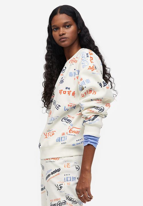 H&M - Printed sweatshirt - cream/coca-cola 