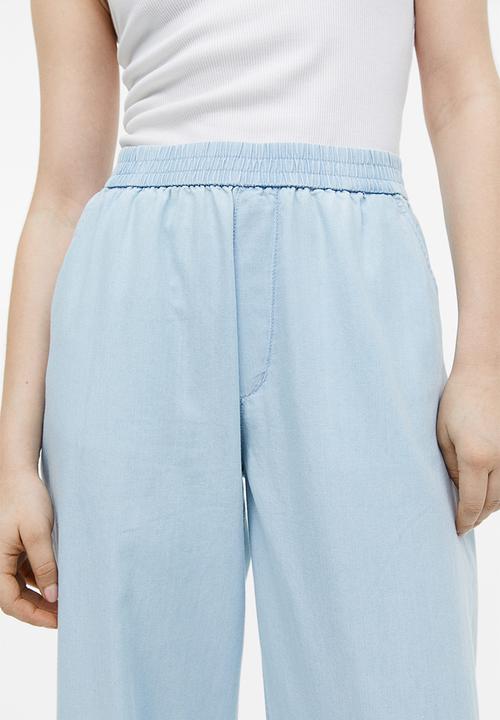 H&M - High-waisted woven joggers - light denim blue 