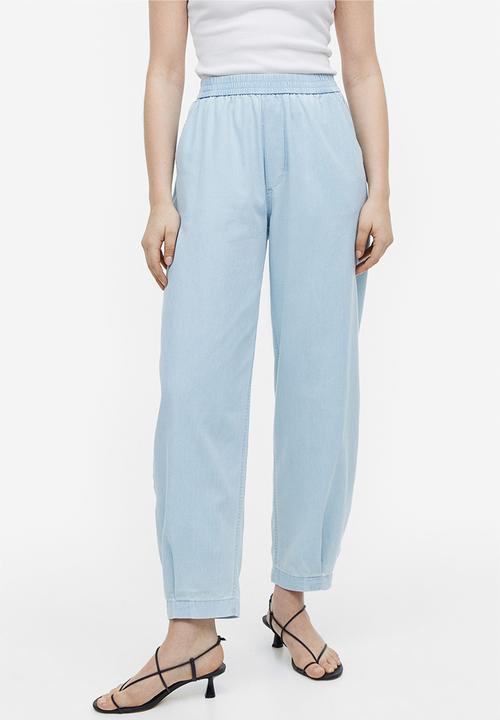 H&M - High-waisted woven joggers - light denim blue 