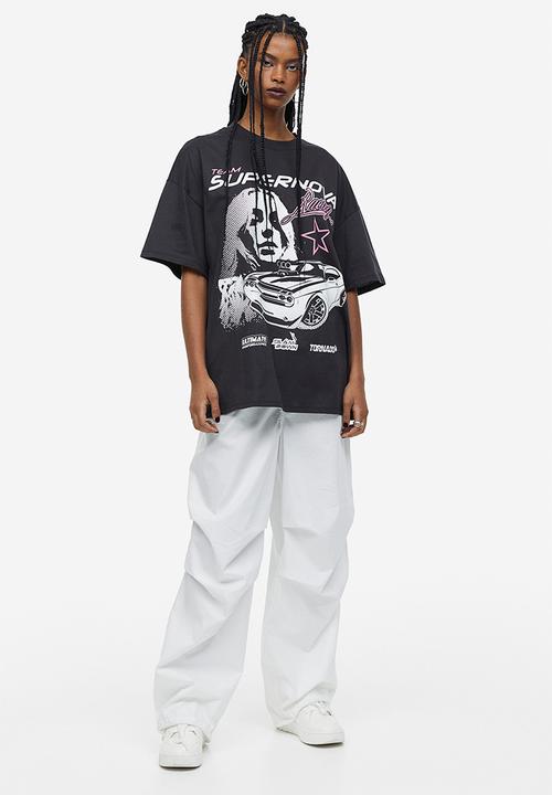 H&M - Oversized printed t-shirt - black / supernova 