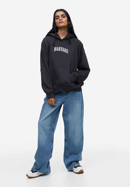 H&M - Oversized printed hoodie - black / harvard