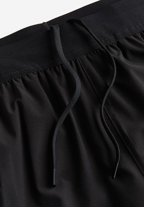 H&M - Drymove™ double-layered sports shorts - black