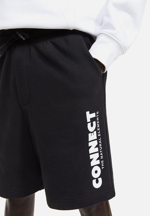 H&M - Relaxed fit printed sweatshorts - black connect 