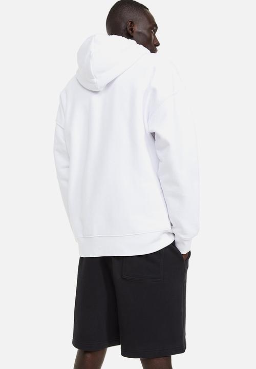 H&M - Relaxed fit printed sweatshorts - black connect 