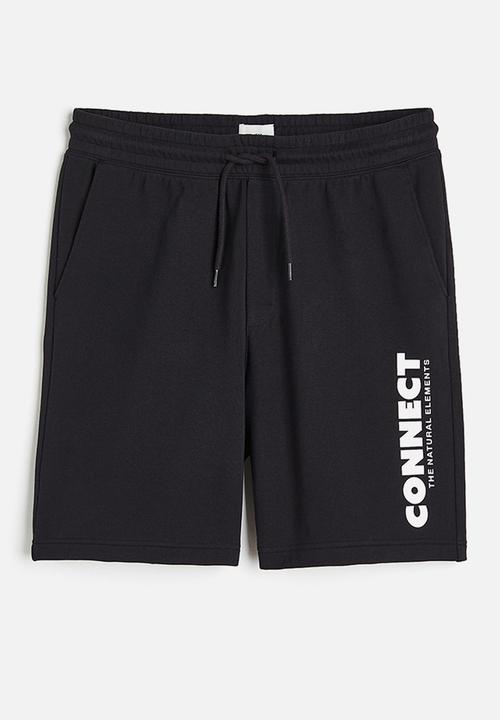 H&M - Relaxed fit printed sweatshorts - black connect 