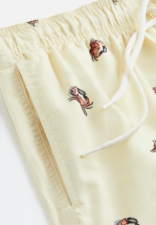 H&M - Patterned swim shorts - light yellow crabs 