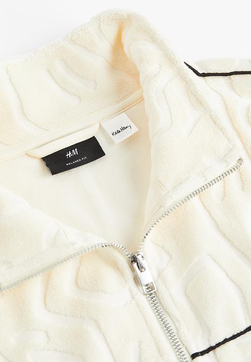 H&M - Relaxed fit terry track jacket - cream keith haring 