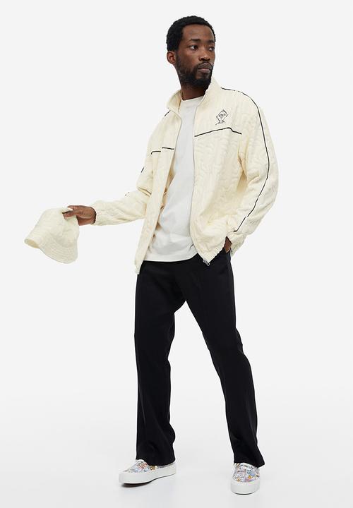 H&M - Relaxed fit terry track jacket - cream keith haring 