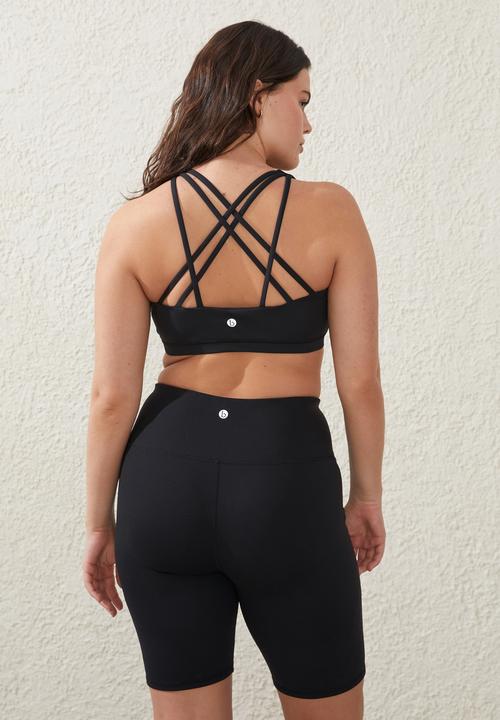 Cotton On - Plus recycled strappy sports crop - black