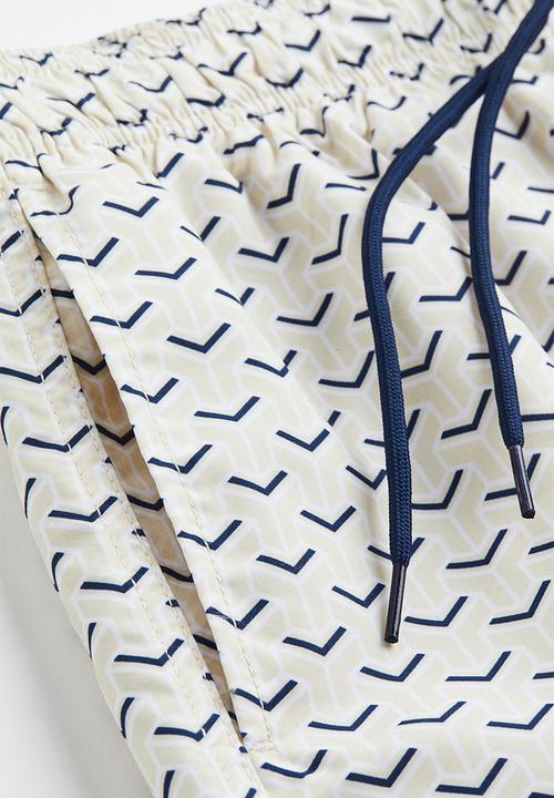 H&M - Patterned swim shorts - light beige patterned