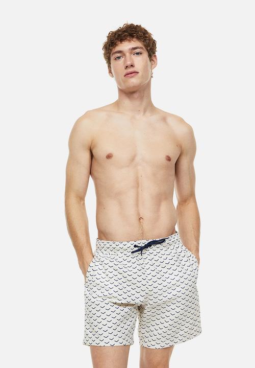 H&M - Patterned swim shorts - light beige patterned