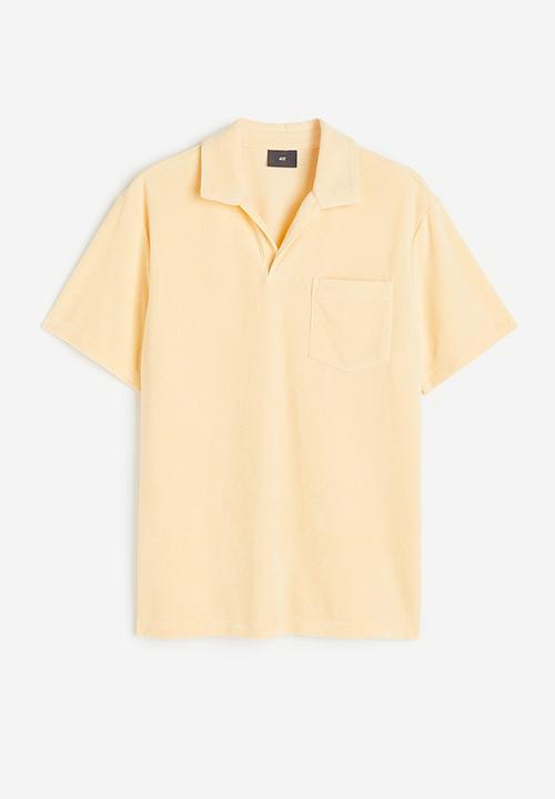 H&M - Regular fit terry polo shirt - light yellow