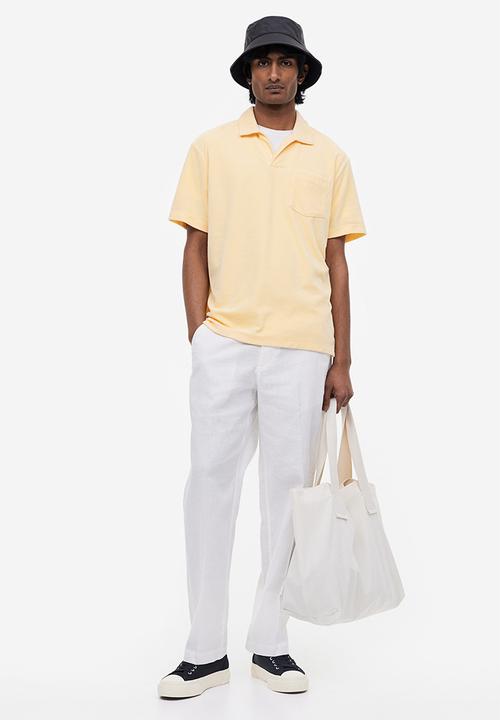 H&M - Regular fit terry polo shirt - light yellow
