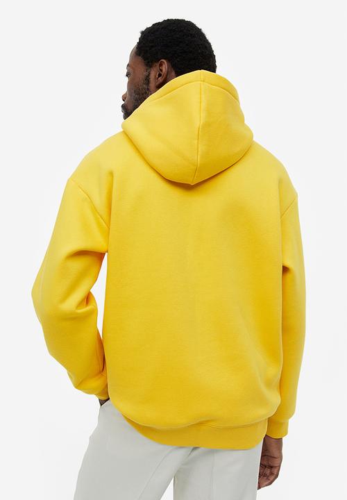 H&M - Relaxed fit hoodie - yellow keith haring