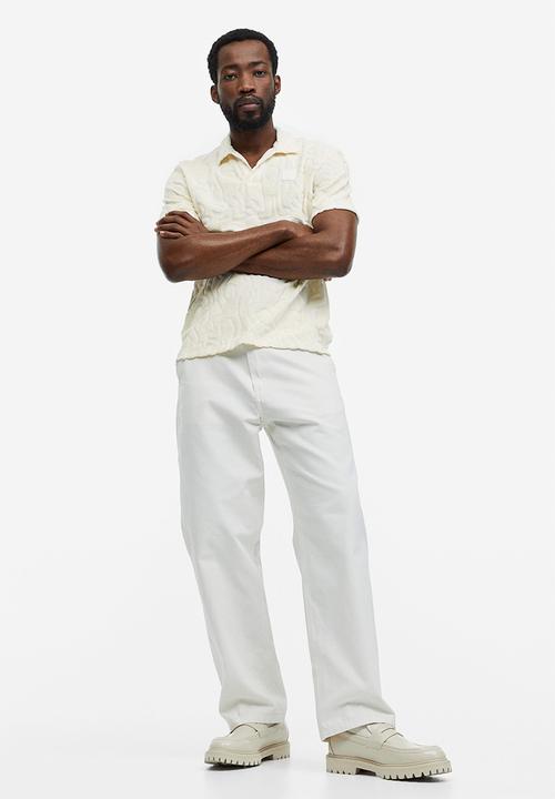 H&M - Regular fit terry polo shirt - cream keith haring