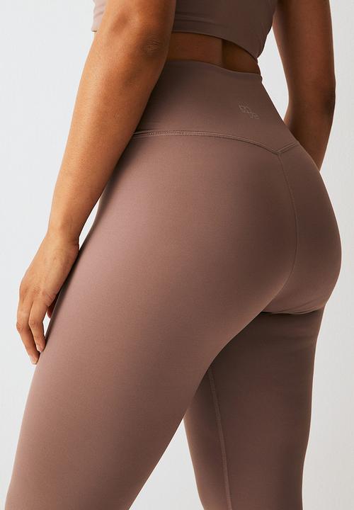 H&M - Softmove™ sports tights - beige