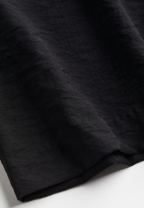 H&M - Flared trousers - black