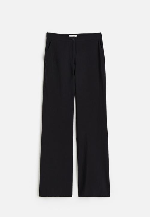 H&M - Flared trousers - black