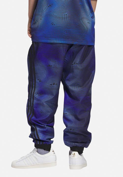 adidas Originals - MV Allover print track pants - blue