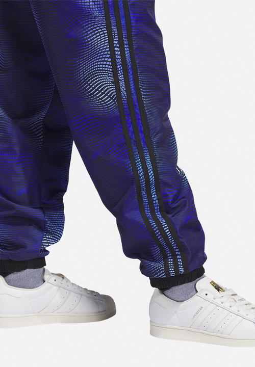 adidas Originals - MV Allover print track pants - blue