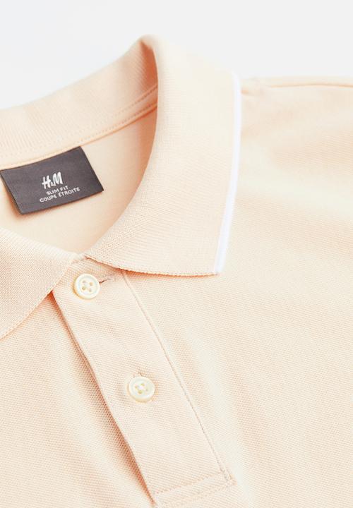 H&M - Slim fit cotton polo shirt - light apricot 