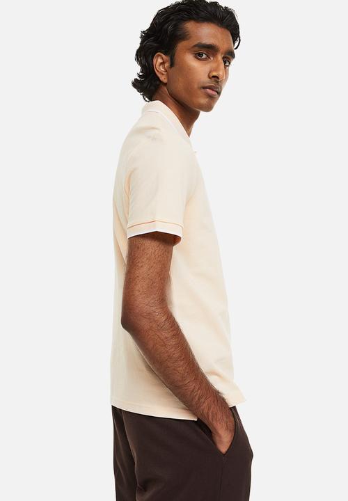H&M - Slim fit cotton polo shirt - light apricot 