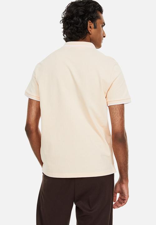 H&M - Slim fit cotton polo shirt - light apricot 