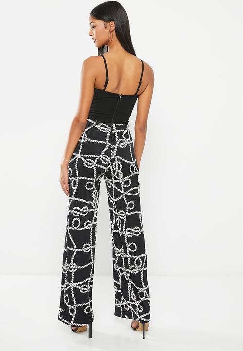 SISSY BOY - Mixed jumpsuit with leg opening - black chain print